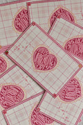 A pink gingham Valentine postcard features a retro heart and swan design.