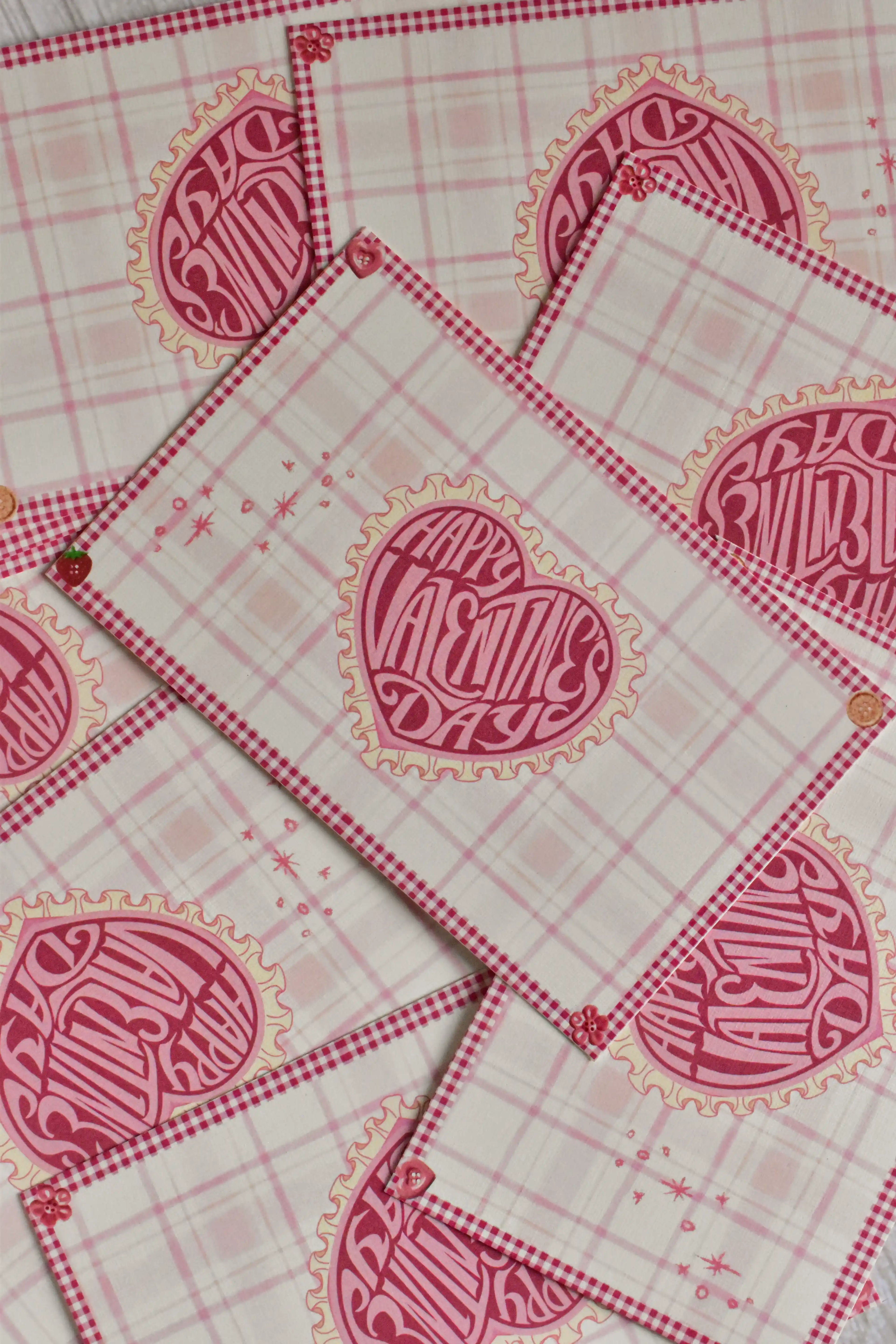 A pink gingham Valentine postcard features a retro heart and swan design.