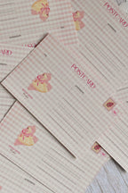 A pink gingham Valentine's postcard features a retro heart and swan illustration on the front.